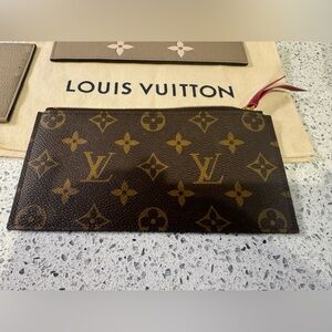 2 Louis Vuitton non-used pouches and 8 pocket wallet